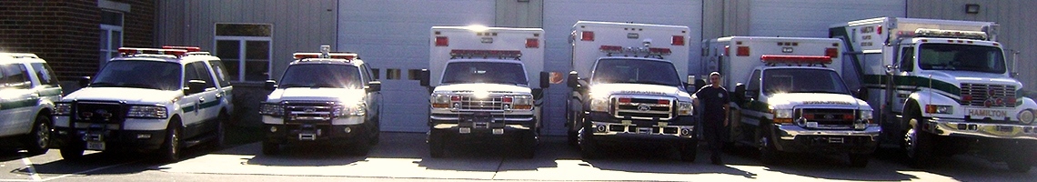 Banner: All HVRS vehicles lined up in front of the building